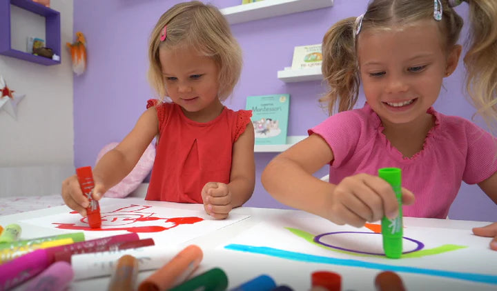 Children using solid tempera paint Kwik stix