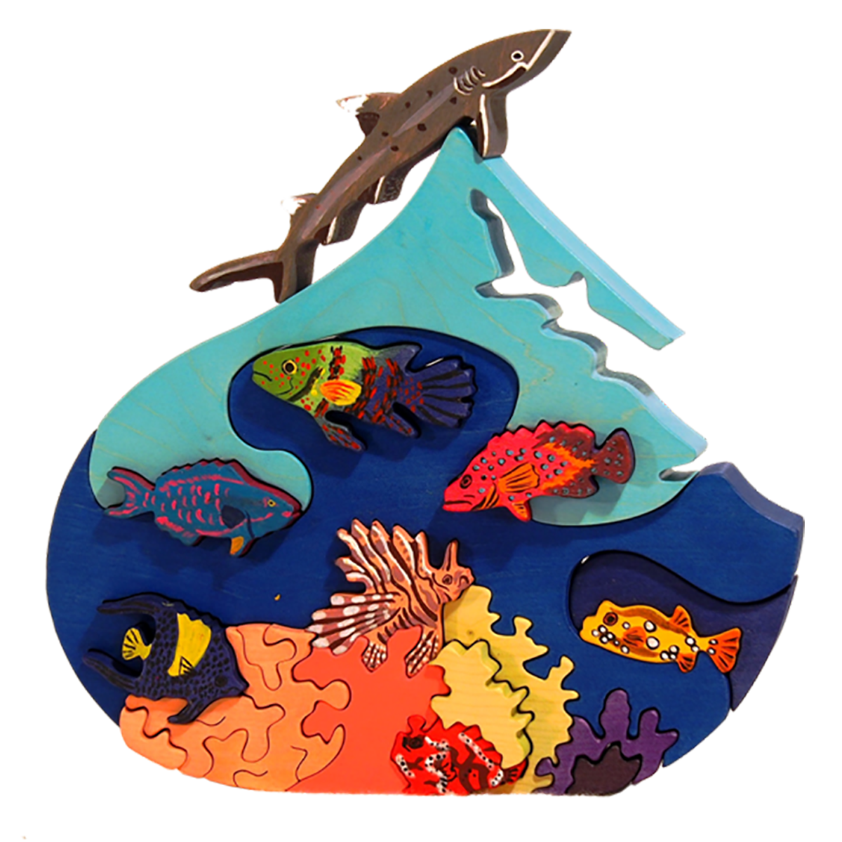 Wooden toy puzzle of the deep ocean with shark, clown fish and tiger fish.