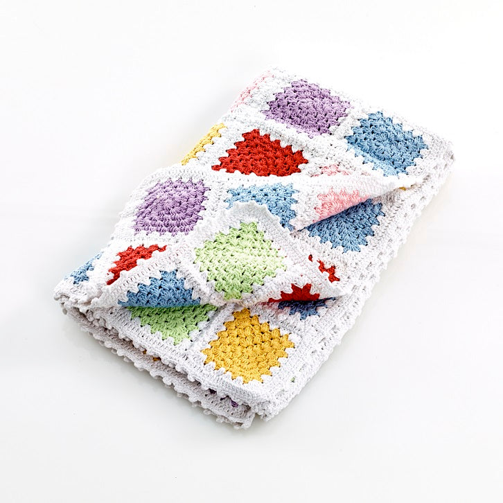 Pastel coloured granny square children blanket