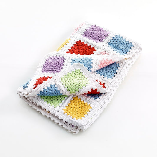 Pastel coloured granny square children blanket