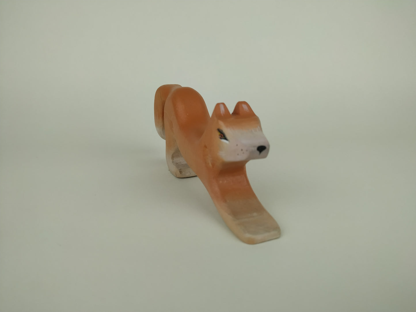 wooden toy fox for toddlers in orange, waiting for pounce