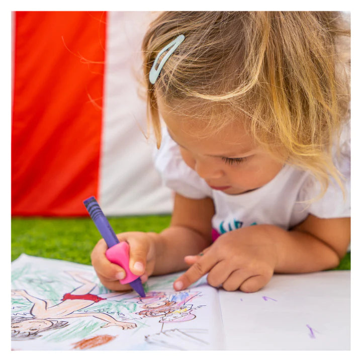 Child using a pink writing aid fitted on a crayon
