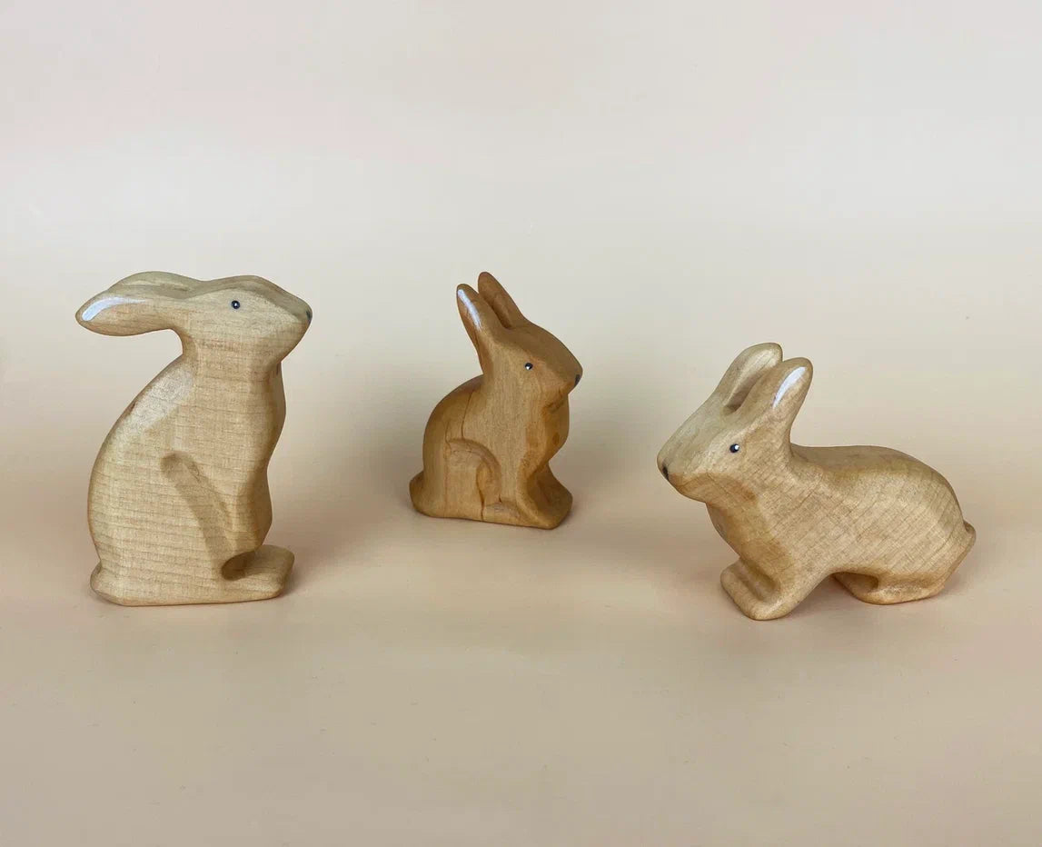 3 pieces of wooden rabbit toys in beige and brown