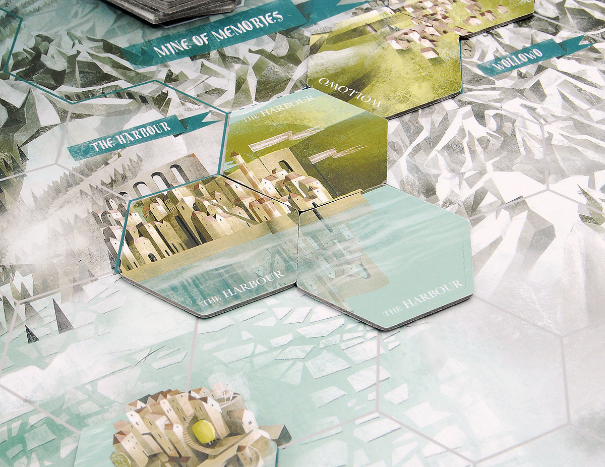 Close up of the forgotten kingdom board game with pieces showing the harbour and mine of memories.