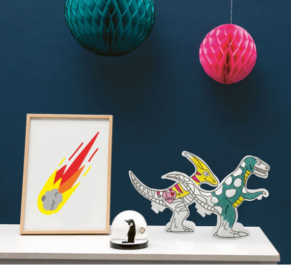 Inflated and coloured dinosaurs on a desk