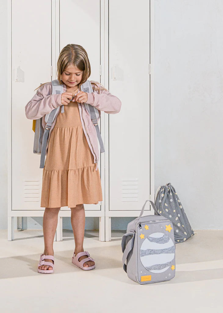 Girl clipping on rocket adventure backpack
