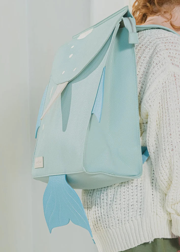 Child wearing under the sea backpack from Cocovillage over her shoulders