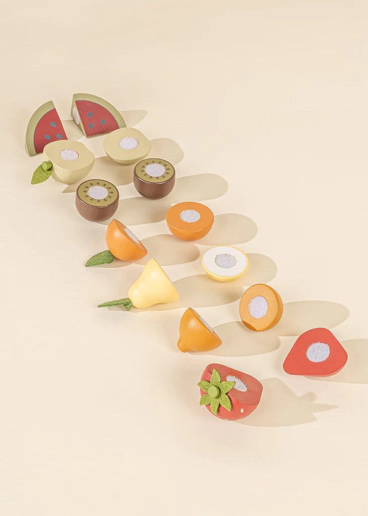 Chopped fruits from wooden fruit playset