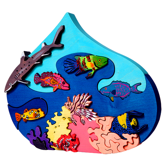 Colourful wooden toy  puzzle of the ocean with deep coral fishes, tiger fish, clown fish and a shark!