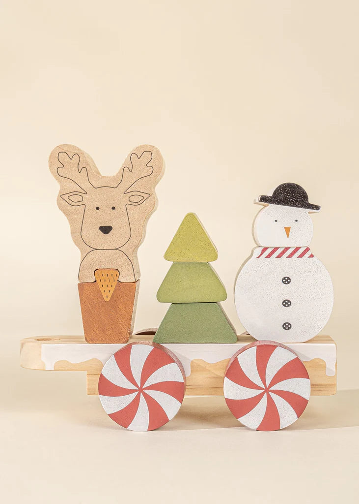 Reindeer, snowman and christmas tree as components of a beautiful wooden stacking toy train