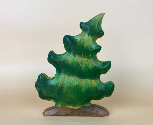 hand-made wooden Christmas tree toy dancing in the wind and swaying to the left