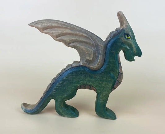 Hand-made wooden dragon toy figure with wings in deep emerald green