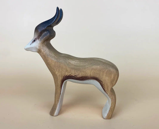Wooden toy gazelle with brown-coloured coat, white underpants and long curved horns