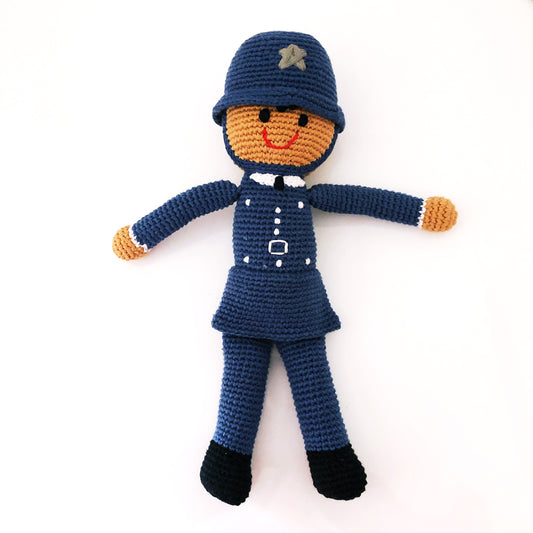 police officer doll in blue uniform and blue police cap