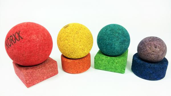 Korxx toy blocks with an indented base nesting 4 different sized coloured cork balls
