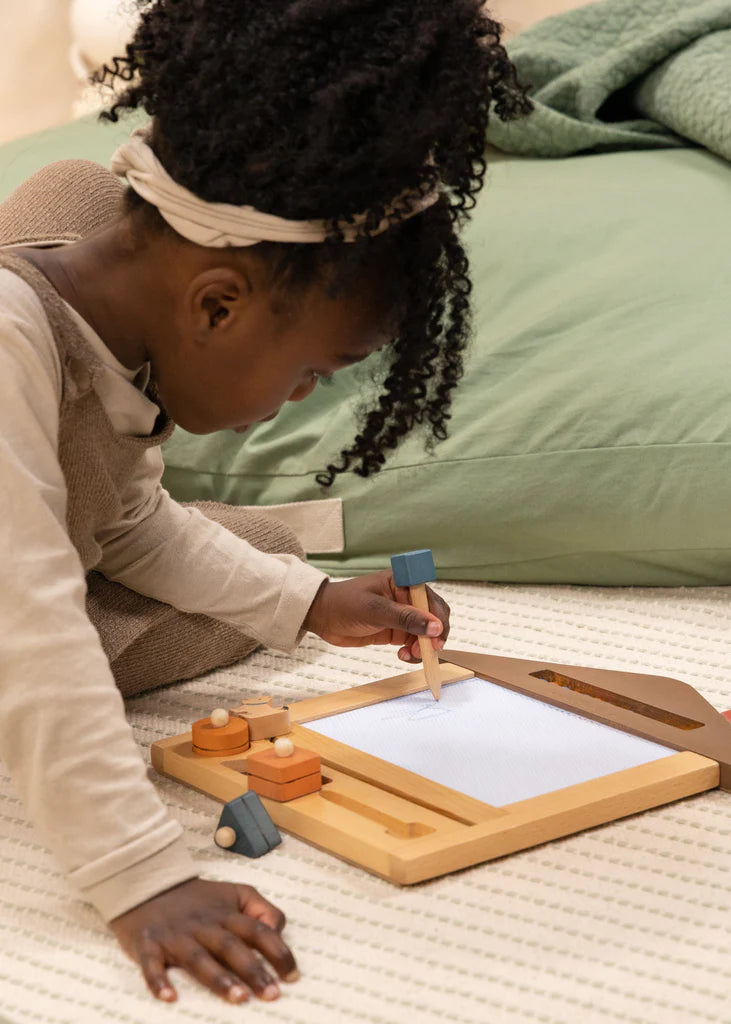 African american child using magic drawing board on left hand!