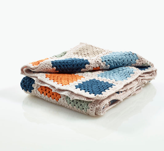 Orange and blue granny square children blanket, hand knitted from Pebblechild