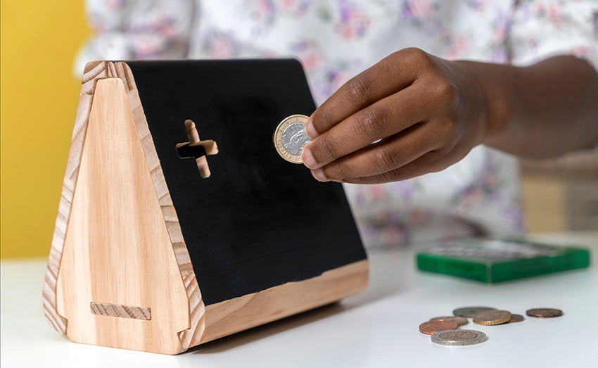 example of the money box from Koa Koa in action: slot in coins and keep track of the amount!