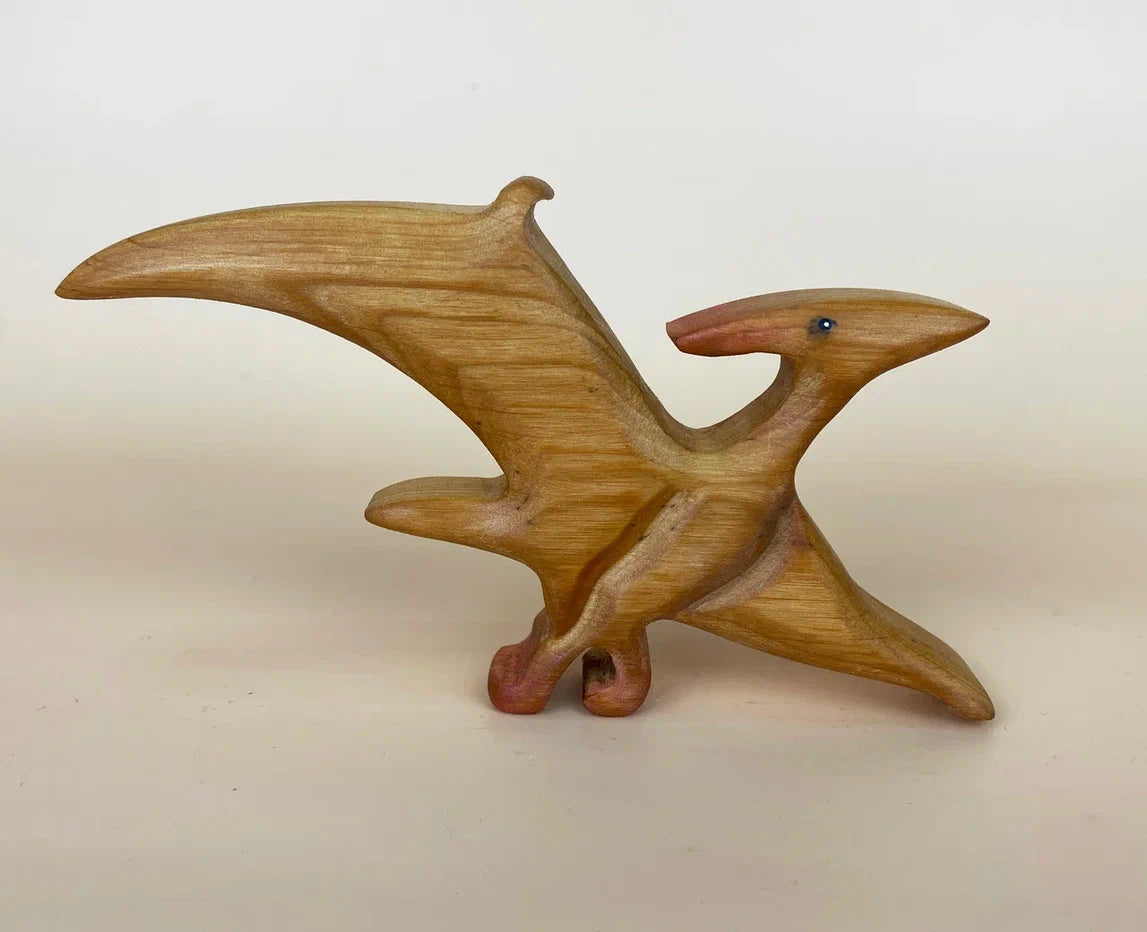Light brown wooden pteranodon toy with spreaded wings