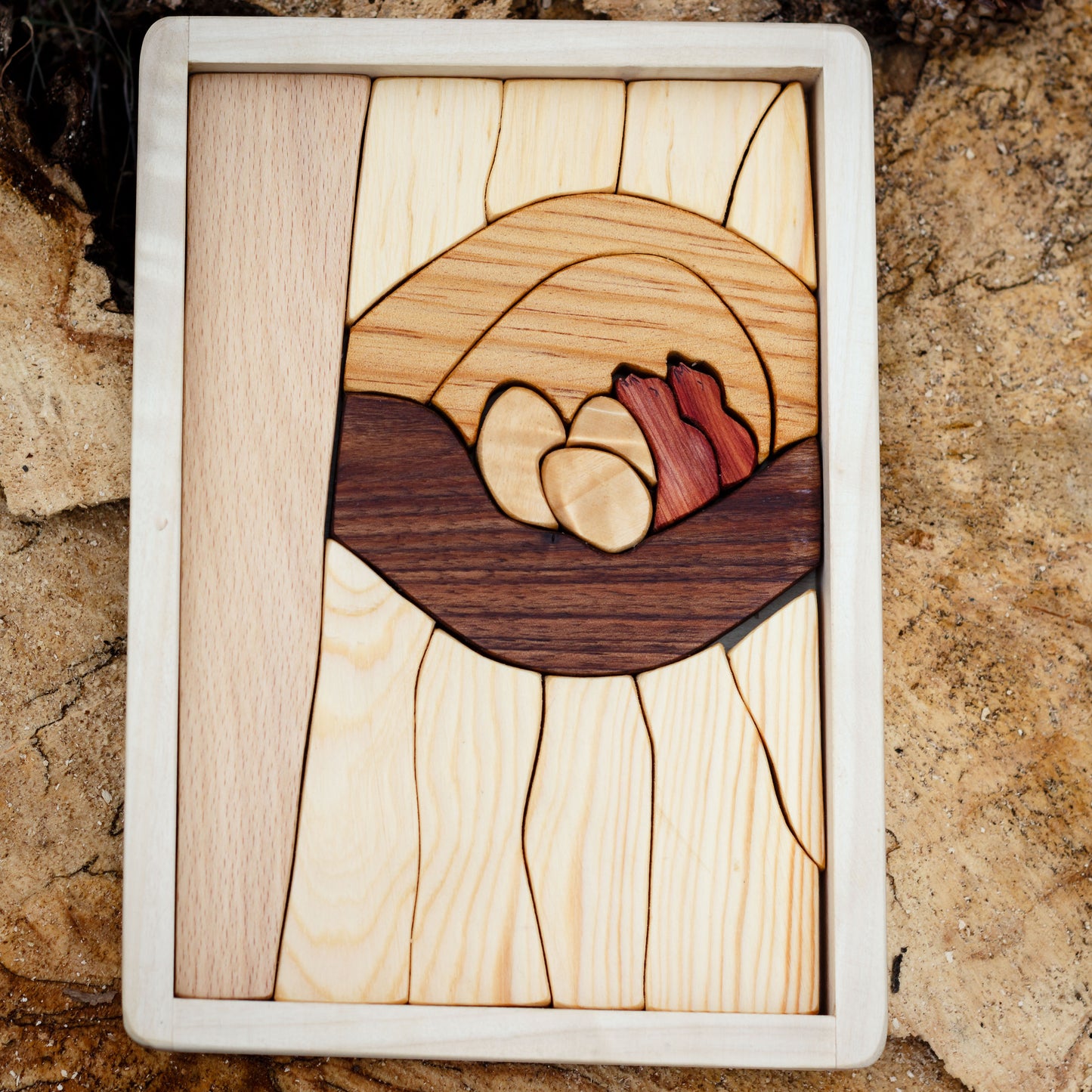 Wooden toy puzzle from Cocoletes- view of the other side featuring the nest