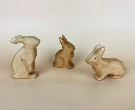 3 pieces of wooden rabbit toys in beige and brown