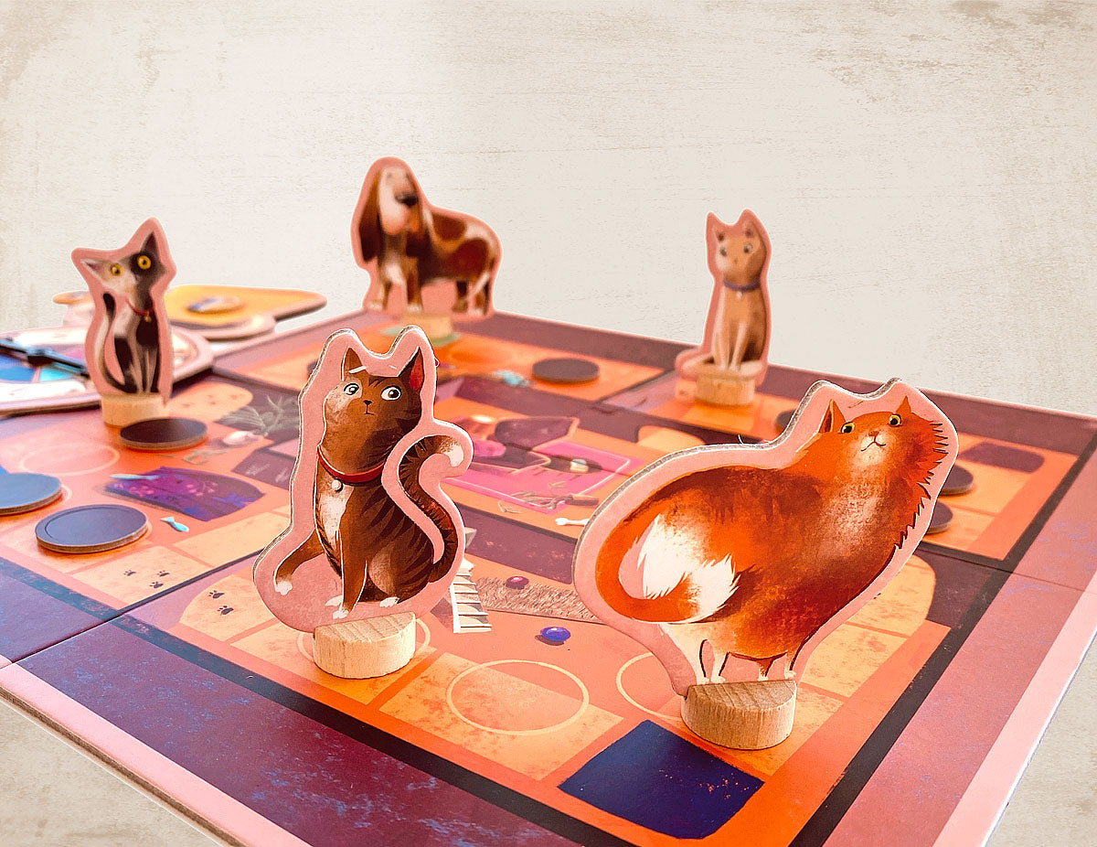 Cat and dog figures on the game board for ther Rainy Day