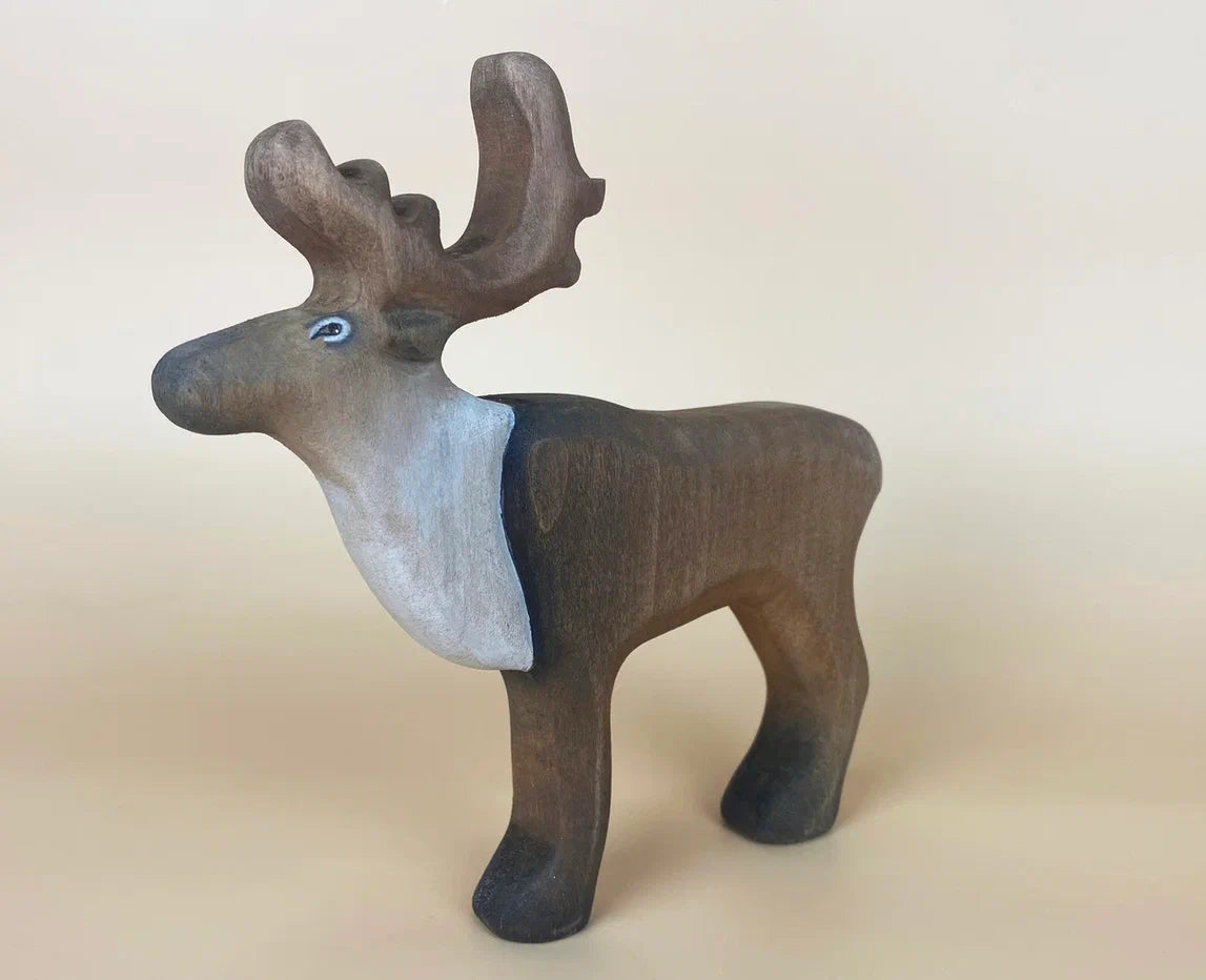 Brown wooden reindeer figurine toy with curves horns and white cape