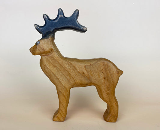 Wooden stag deer toy with elaborate long antlers