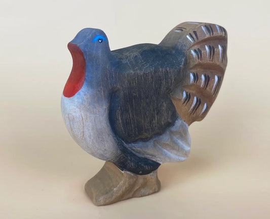 Wooden toy turkey with black feathers and brown tail