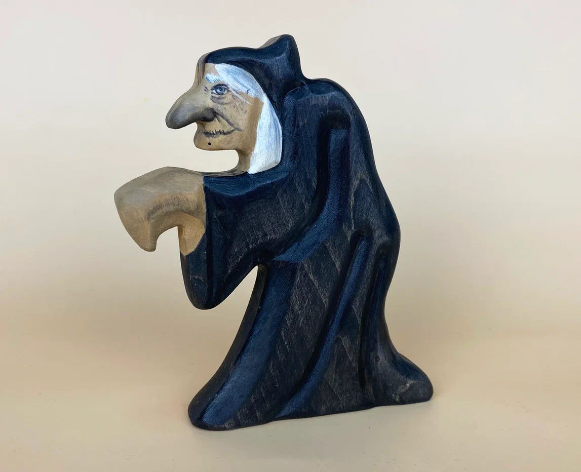 Hunched halloween witch figurine  with a long, big nose and in black robes