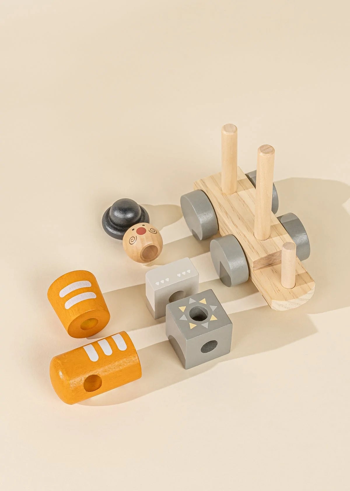 Dissembled components of wooden toy stacking train