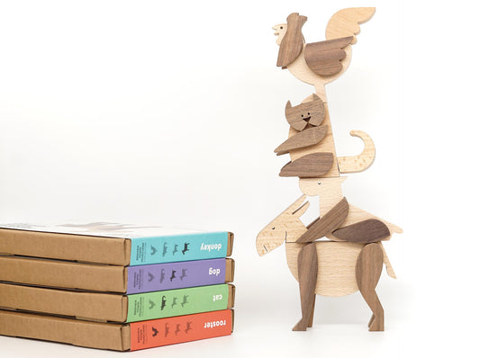 Set of magnetic wooden toys with rooster cat, dog, donkey stacked on top each other