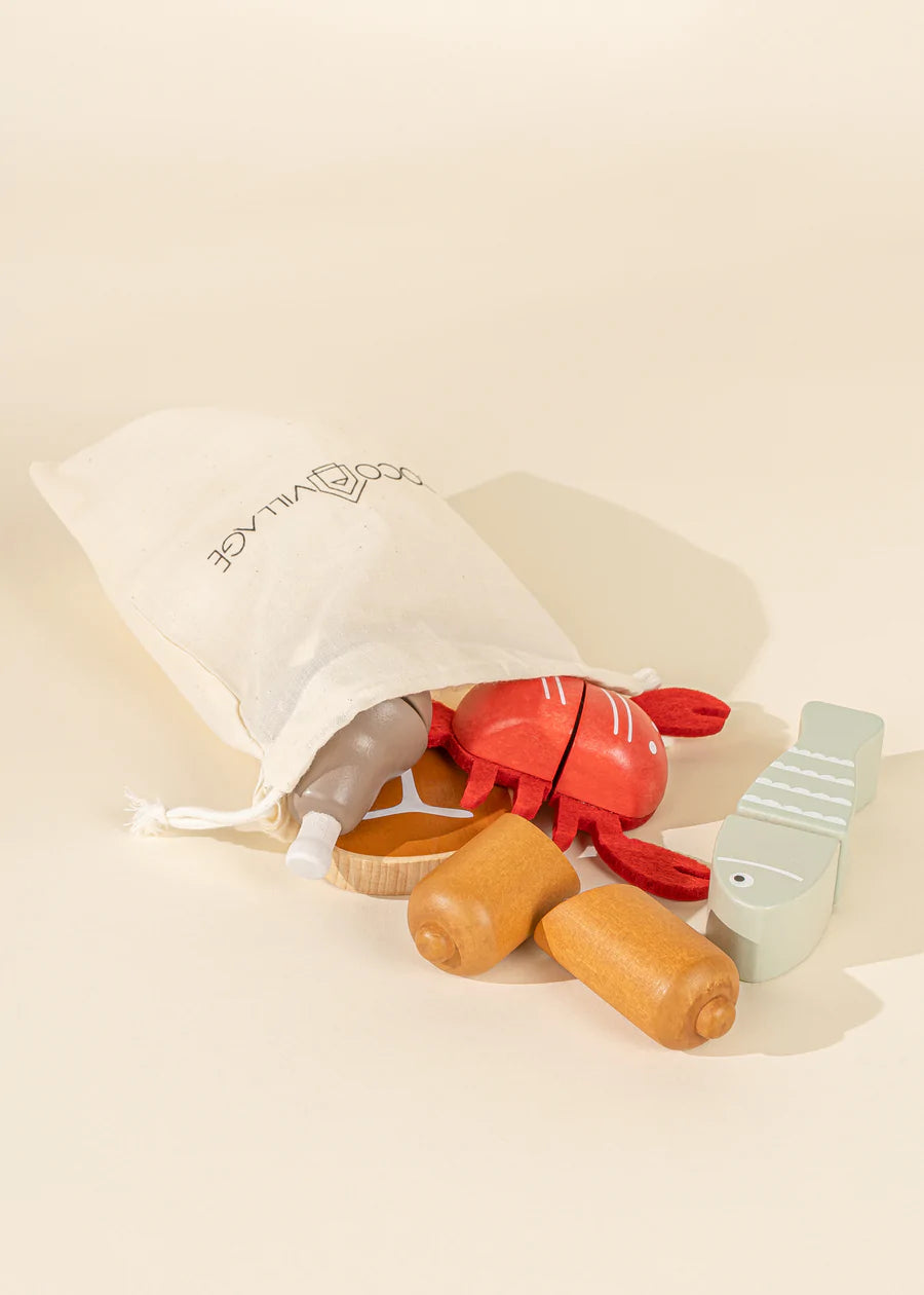 bag of wooden toy fish and meat with sausage and lobster and fish
