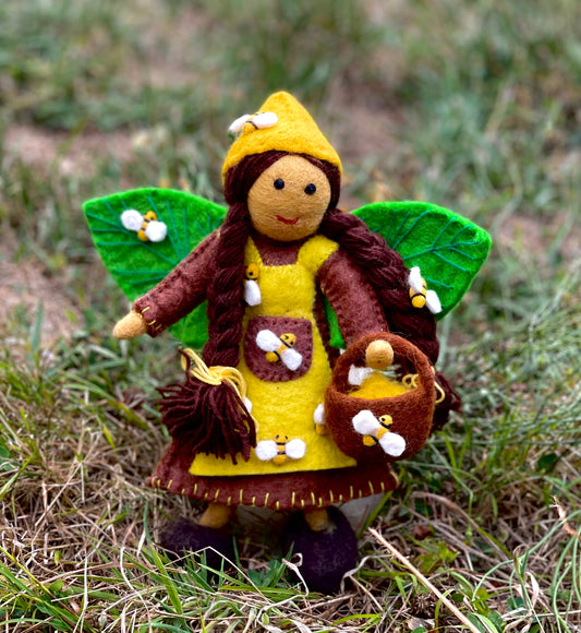 Bee handmade fairy doll in yellow and brown, carrying a basket, from Himalayan Felt Co
