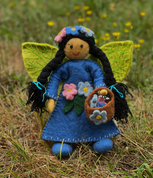 handmade blossom fairy doll in blue gown and sewn flowers, carrying a basket. From Himalayan Felt Co.
