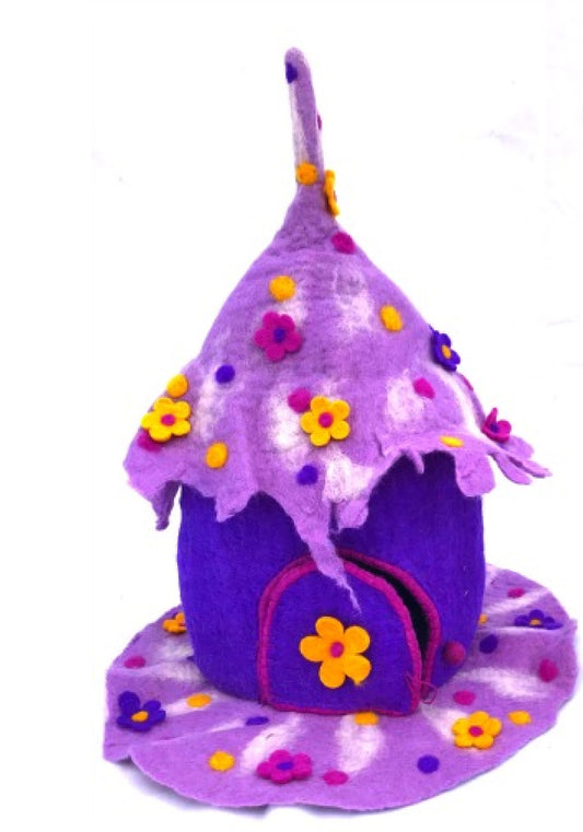 purple and pink felted toy fairy home with a pointed roof and sewn on flowers
