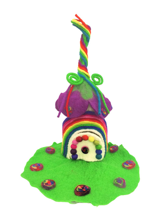Colourful felted rainbow fairy home with whimsical design and green lawns