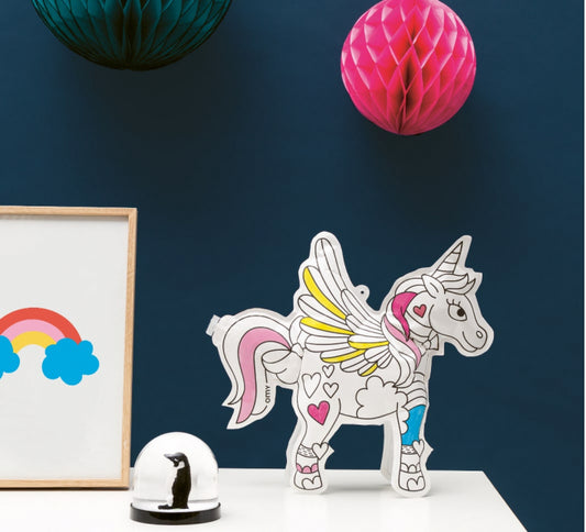 Omy inflate and colour your own unicorn standing on a table