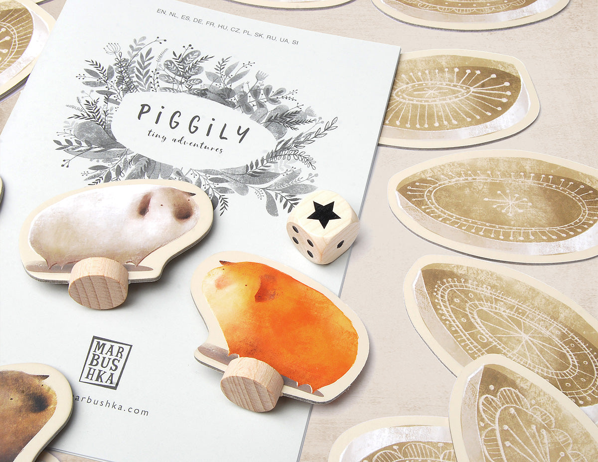 Close uo of piggily board game with dice and guinea pig figures