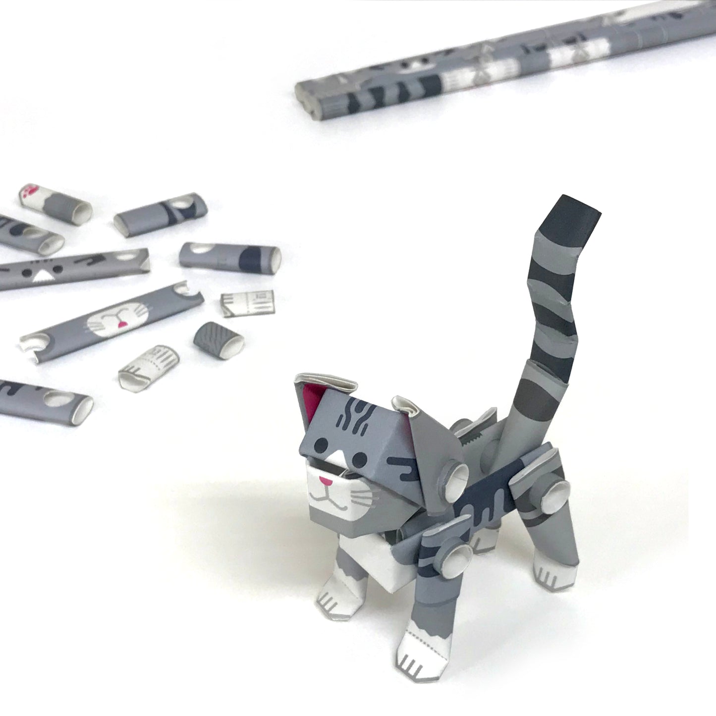 Components of the kit of make your own cat from Piperoid with completed product