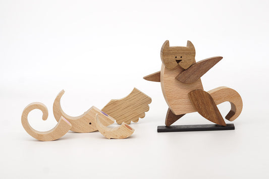 Wooden magnetic toy cat standing and waving