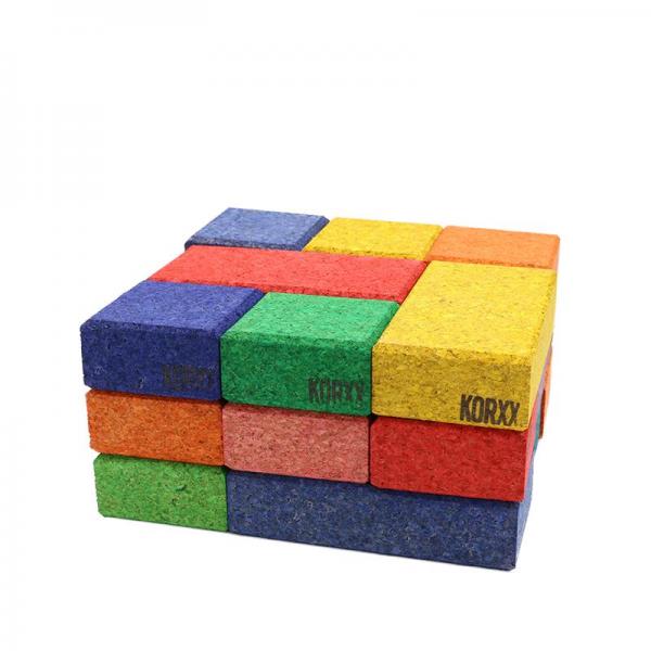 Korxx cork building blocks- cuboids in mixed colours, neatly stacked into a bigger cube