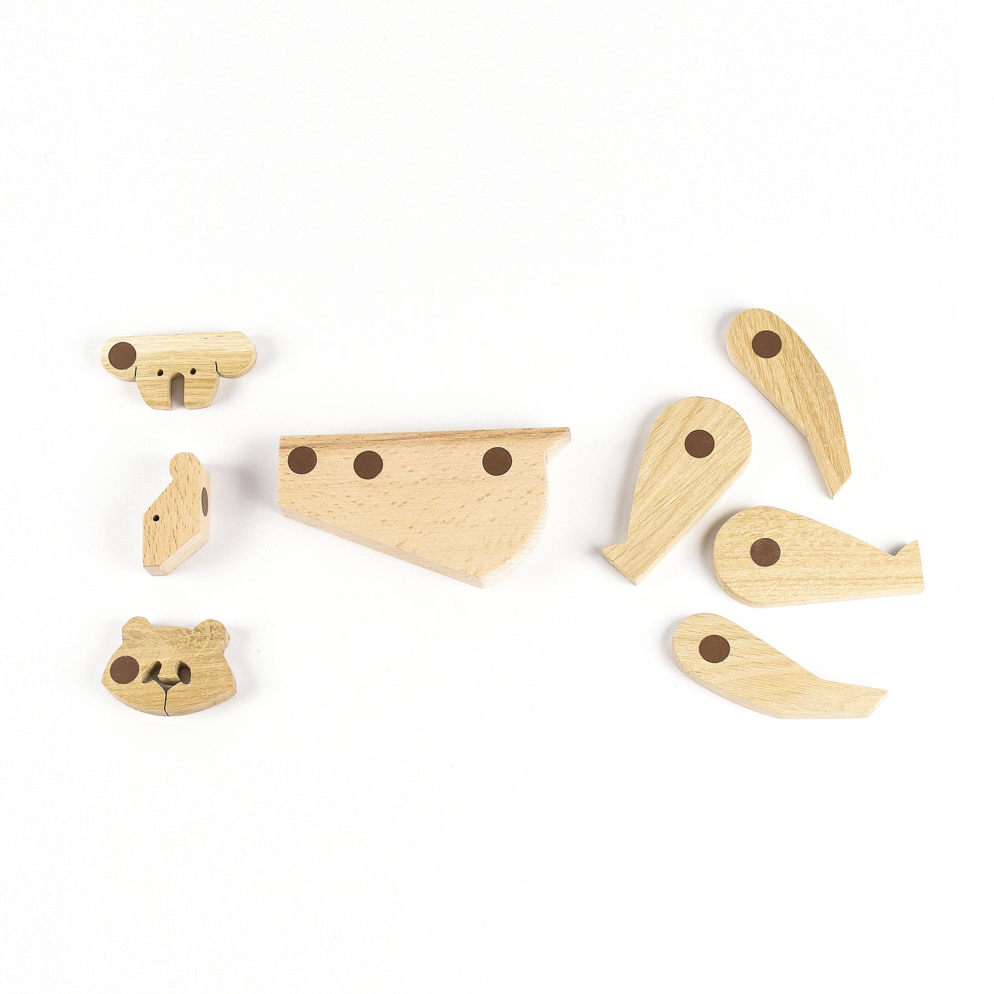 pieces of magnets to assemble a wooden toy panda, koala and bear